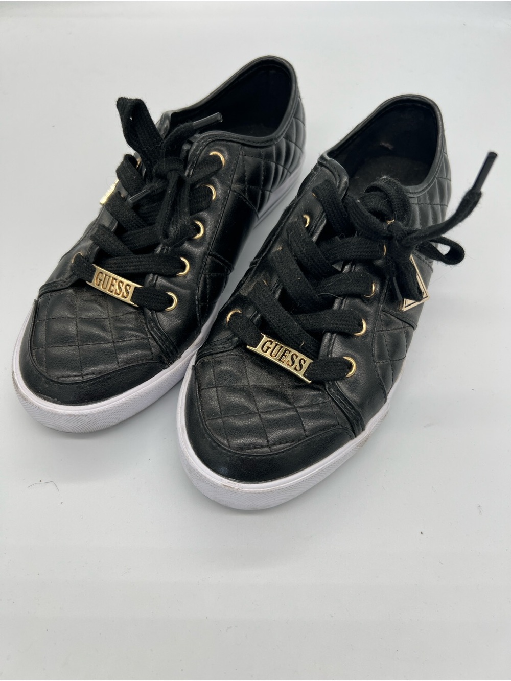 Guess Black Quilted Sneakers with Gold Hardware and White Sole